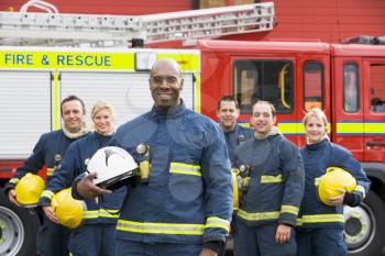 Royalty Free Photo of Firefighters Beside the Truck