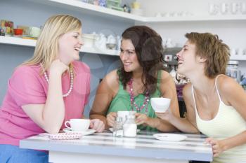 Royalty Free Photo of a Table Talking and Drinking Tea