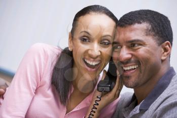 Royalty Free Photo of a Couple Hearing Good News