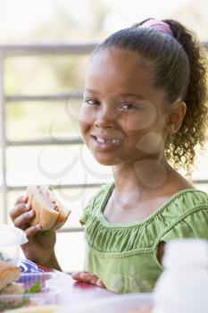 Royalty Free Photo of a Student Eating Lunch