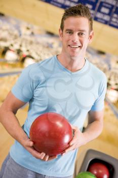 Royalty Free Photo of a Man at a Bowling Alley