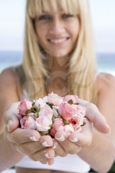 Royalty Free Photo of a Woman Holding Roses