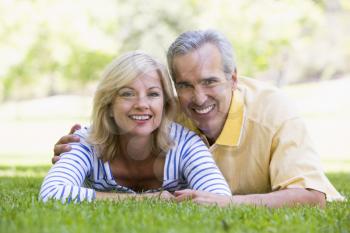 Royalty Free Photo of a Couple on the Lawn