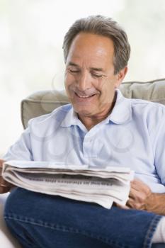 Royalty Free Photo of a Man Relaxing With the Newspaper