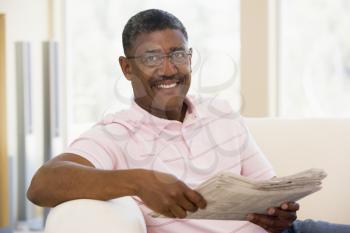 Royalty Free Photo of a Man Reading a Newspaper