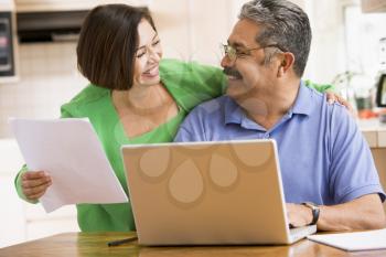 Royalty Free Photo of a Couple With a Laptop