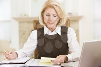 Royalty Free Photo of a Woman Doing Paperwork