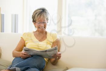 Royalty Free Photo of a Woman With a Newspaper