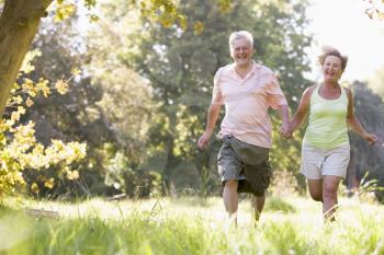 Royalty Free Photo of a Couple Running