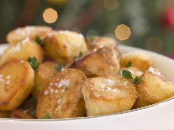 Royalty Free Photo of a Dish of Roast Potatoes with Sea Salt and Lemon Thyme