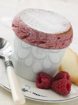 Royalty Free Photo of Hot Raspberry Souffle with Langue de Chat Biscuits