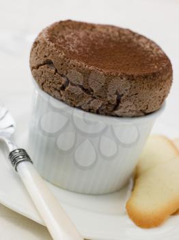 Royalty Free Photo of Hot Chocolate Souffle with Langue de Chat Biscuits