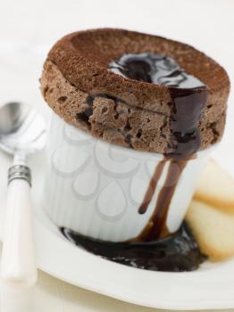 Royalty Free Photo of Hot Chocolate Souffle With Chocolate Sauce and Langue de Chat Biscuits
