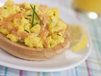 Royalty Free Photo of Smoked Salmon Scrambled Egg on a Toasted Bagel