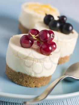 Royalty Free Photo of a Trio of Individual Cheesecakes