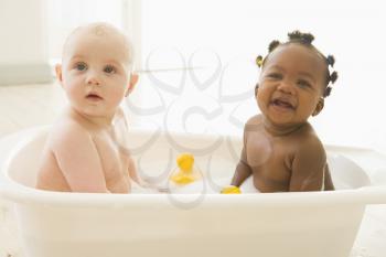 Royalty Free Photo of Two Babies in a Bubble Bath