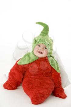 Royalty Free Photo of a Baby in a Pepper