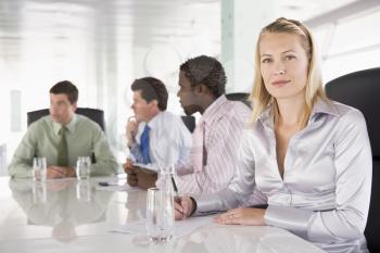 Royalty Free Photo of Four People in a Boardroom