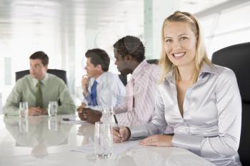 Royalty Free Photo of Four People in a Boardroom
