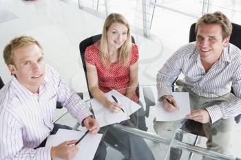 Royalty Free Photo of Three People With Paperwork