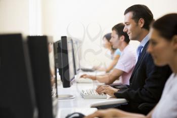 Royalty Free Photo of Four People at Computers