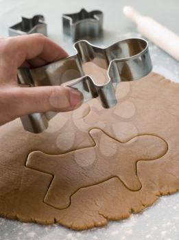 Royalty Free Photo of Cutting Out a Gingerbread Man