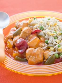 Royalty Free Photo of Sweet and Sour Chicken With Egg Fried Rice