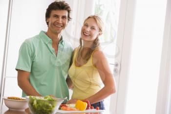 Royalty Free Photo of a Couple in the Kitchen