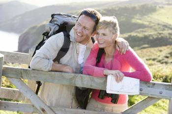 Royalty Free Photo of Hikers at a Fence