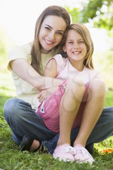 Royalty Free Photo of a Mother Hugging Her Daughter