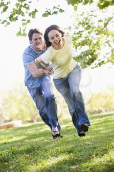 Royalty Free Photo of a Couple Running