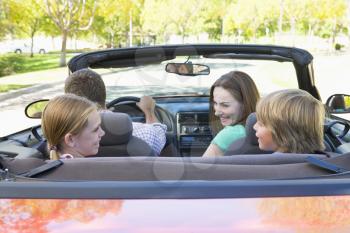 Royalty Free Photo of a Family in a Convertible