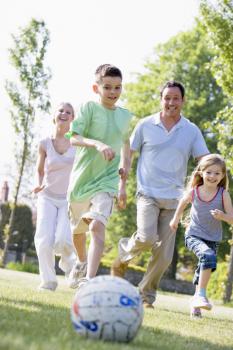 Royalty Free Photo of a Family Playing Outside