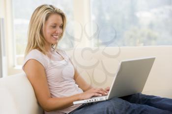 Royalty Free Photo of a Woman at Home With a Laptop