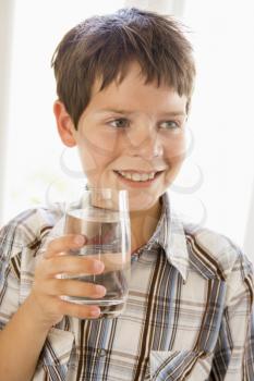 Royalty Free Photo of a Child With a Glass of Water