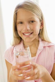 Royalty Free Photo of a Girl With a Glass of Water