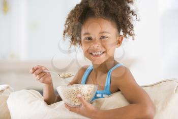 Royalty Free Photo of a Little Girl Eating Cereal