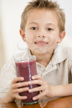 Royalty Free Photo of a Boy With Juice