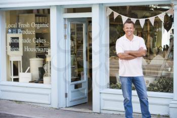 Royalty Free Photo of a Man Outside an Organic Food Store