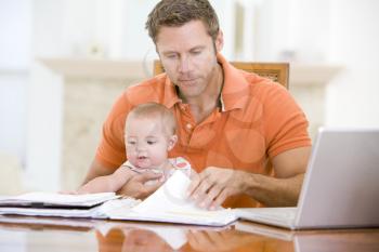 Royalty Free Photo of a Father and Child at a Laptop