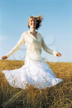 Royalty Free Photo of a Woman Spinning Outside