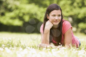Royalty Free Photo of a Woman Lying in a Field
