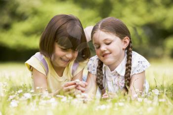 Royalty Free Photo of Two Sisters in a Field