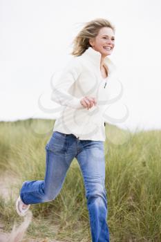 Royalty Free Photo of a Woman Running at the Beach