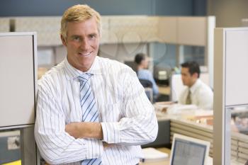 Royalty Free Photo of a Man in an Office Cubicle