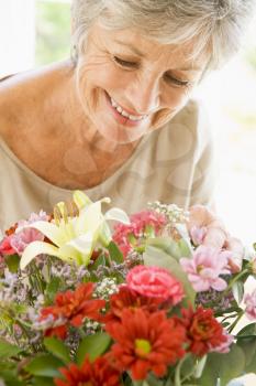 Royalty Free Photo of a Woman With Flowers