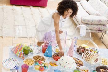 Royalty Free Photo of a Woman With a Table of Food