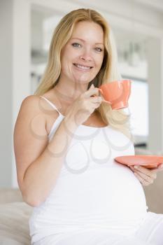 Royalty Free Photo of a Pregnant Woman Drinking Tea