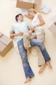 Royalty Free Photo of a Couple Lying on the Floor