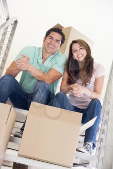 Royalty Free Photo of a Couple Sitting on a Staircase